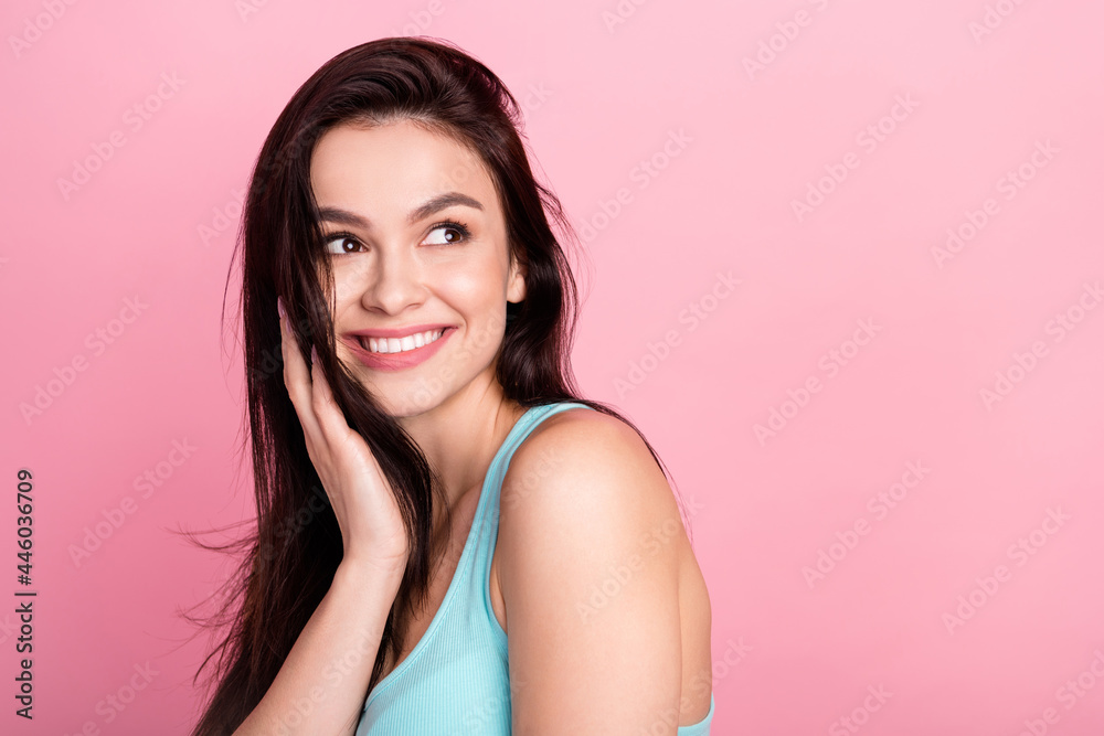 Photo of sweet beauty millennial lady look empty space wear blue top isolated on pink color background Photo of sweet beauty millennial lady look empty space wear blue top isolated on pink color background