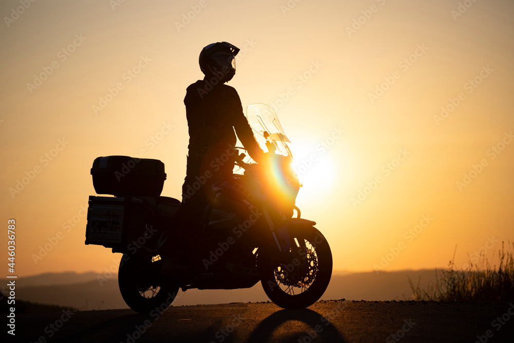 Fototapeta premium Driver riding motorcycle on an empty road