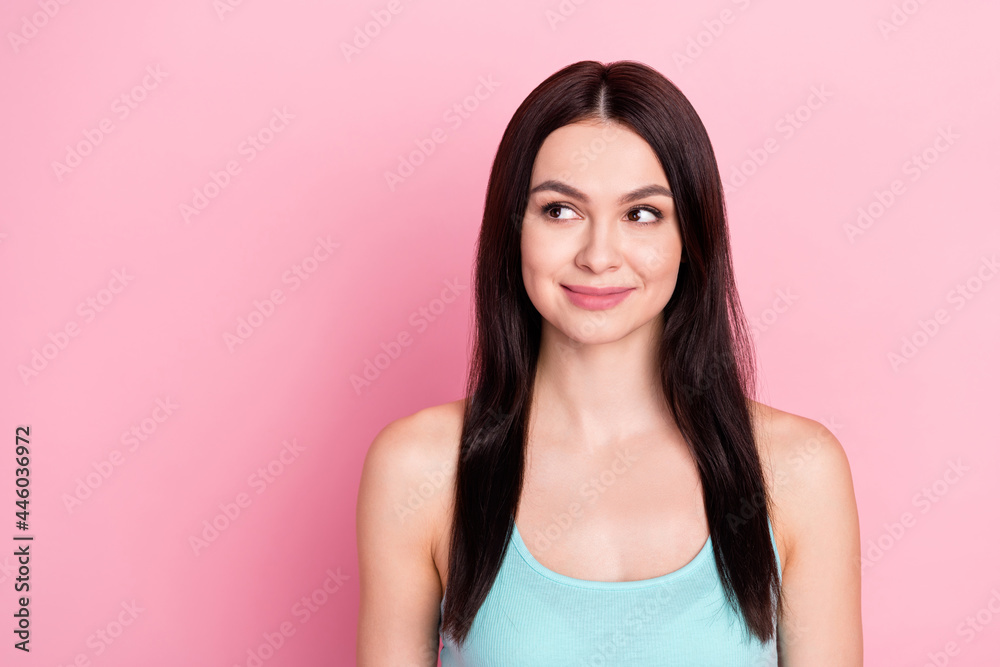 Photo of sporty lovely brown long hairdo lady look empty space wear blue top isolated on pastel pink color background Photo of sporty lovely brown long hairdo lady look empty space wear blue top isolated on pastel pink color background