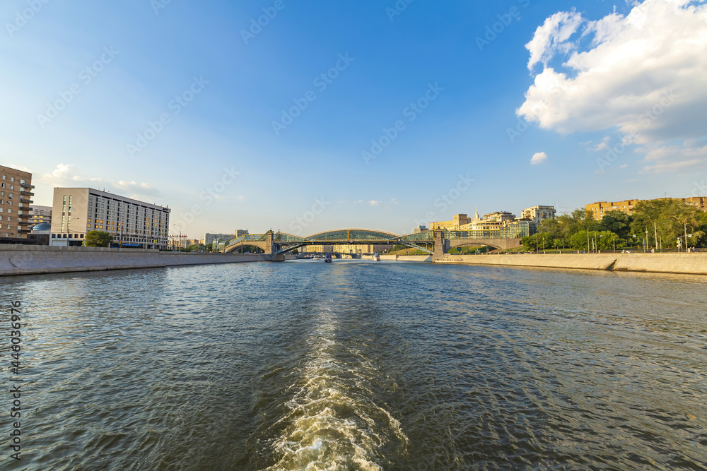 Fototapeta premium Moskva River and urban architecture of the capital downtown on a summer day. Moscow, Russia