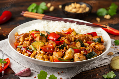 Kung Pao Chicken with Peppers, zucchini and rice. Asian take away food