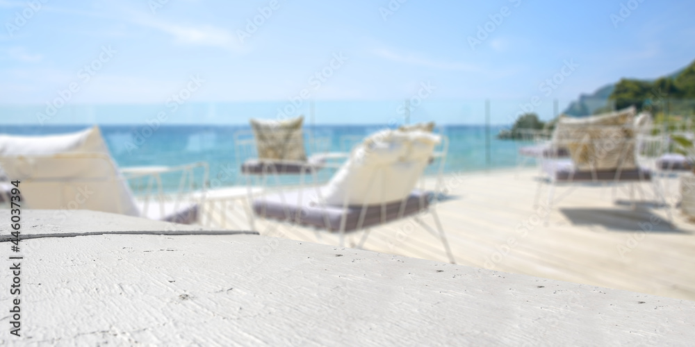 Obraz premium White wooden desk of free space and summer landscape of beach 