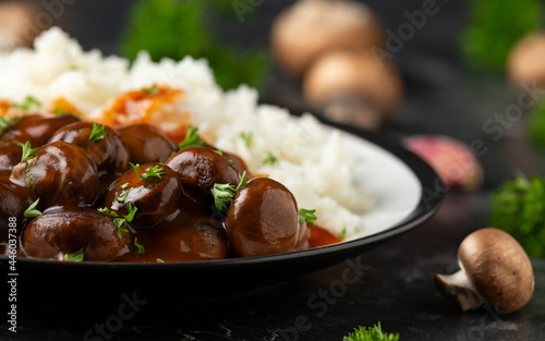 Mushrooms in Balsamic Soy rich sauce with rice. healthy vegan food.