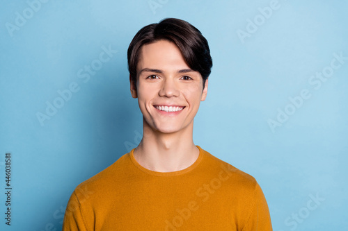 Photo of young cheerful man happy positive toothy smile oral care dentist veneers isolated over blue color background