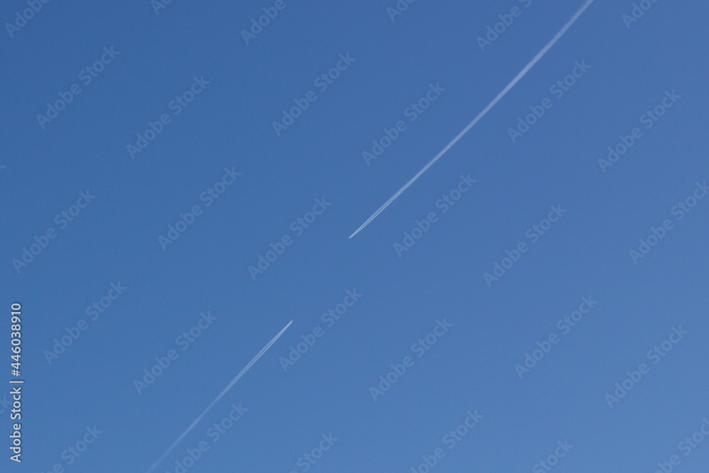Clear blue sky with condensation trail of plane Clear blue sky with condensation trail of plane