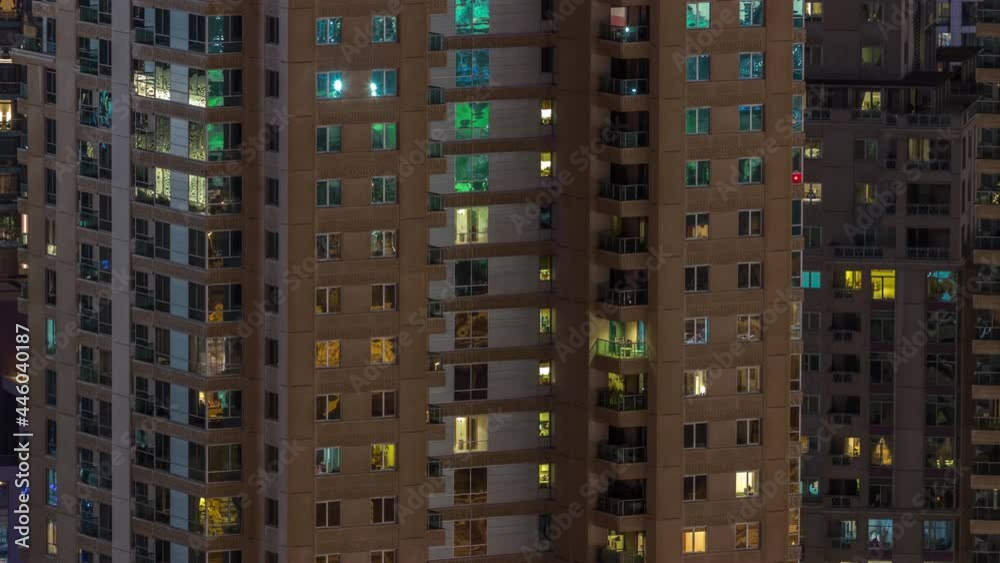 Windows in high-rise building exterior in the late evening with interior lights on timelapse Windows in high-rise building exterior in the late evening with interior lights on timelapse