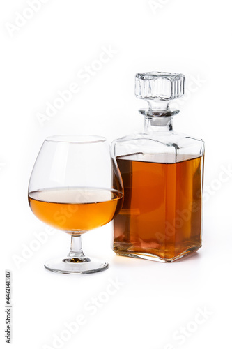 Cognac or whiskey drink isolated on white background
