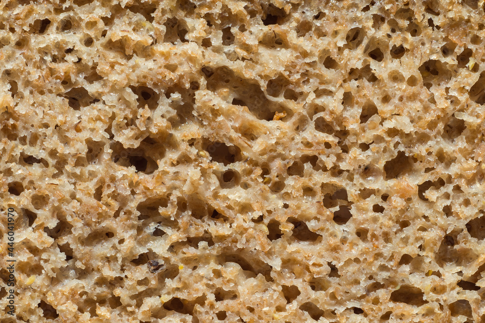 Freshly baked rye bread as texture background. Bread cross-section