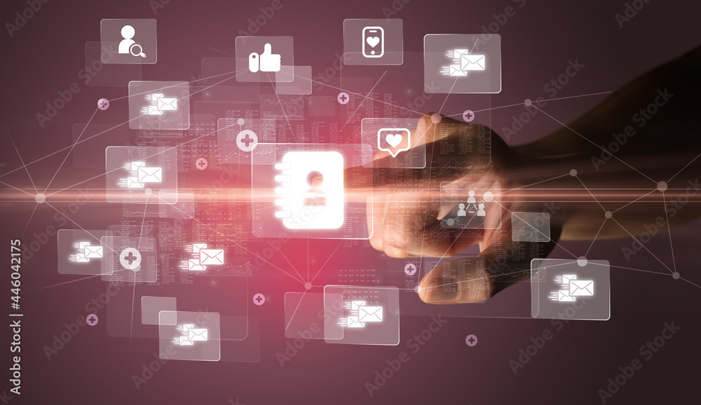 Hand pressing social media multimedia application screen with media icons on futuristic concept Hand pressing social media multimedia application screen with media icons on futuristic concept