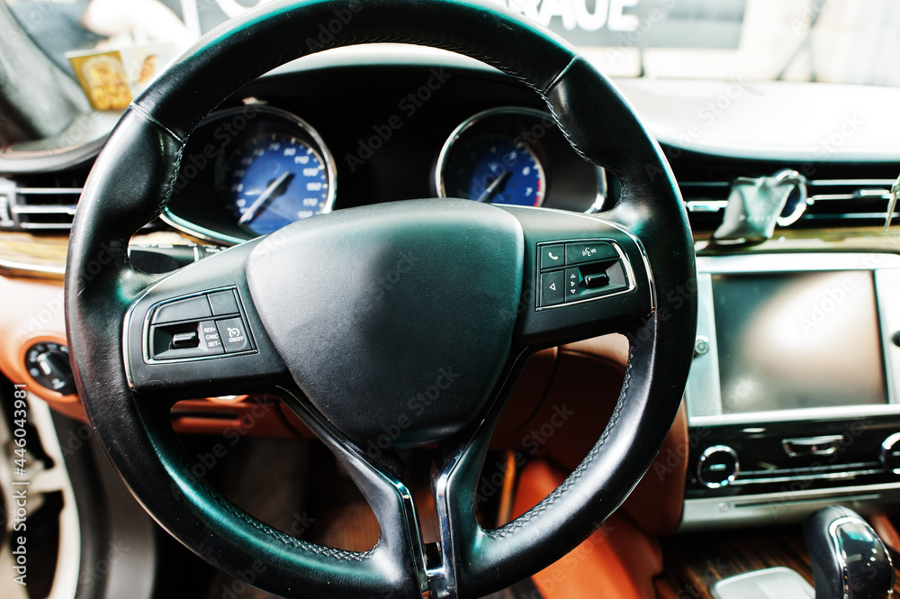 Car steering wheel interior of luxury transport.
