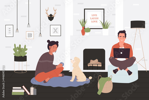 Couple people spend time with pet by home fireplace vector illustration. Cartoon happy man woman characters sitting together, playing with dog, guy with laptop in modern room interior background