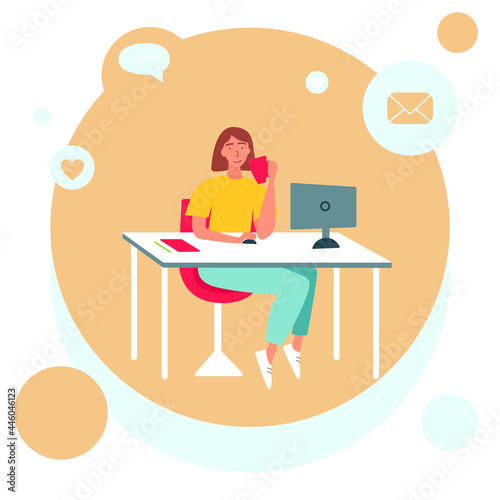 The concept of freelancing, working at home. A woman is sitting at a table in front of a computer and drinking a drink from a cup.