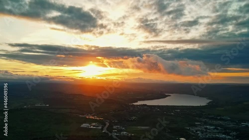 Aerial drone view of Moldova at sunset. Panorama view of hills, greenery, lake, clouds photo