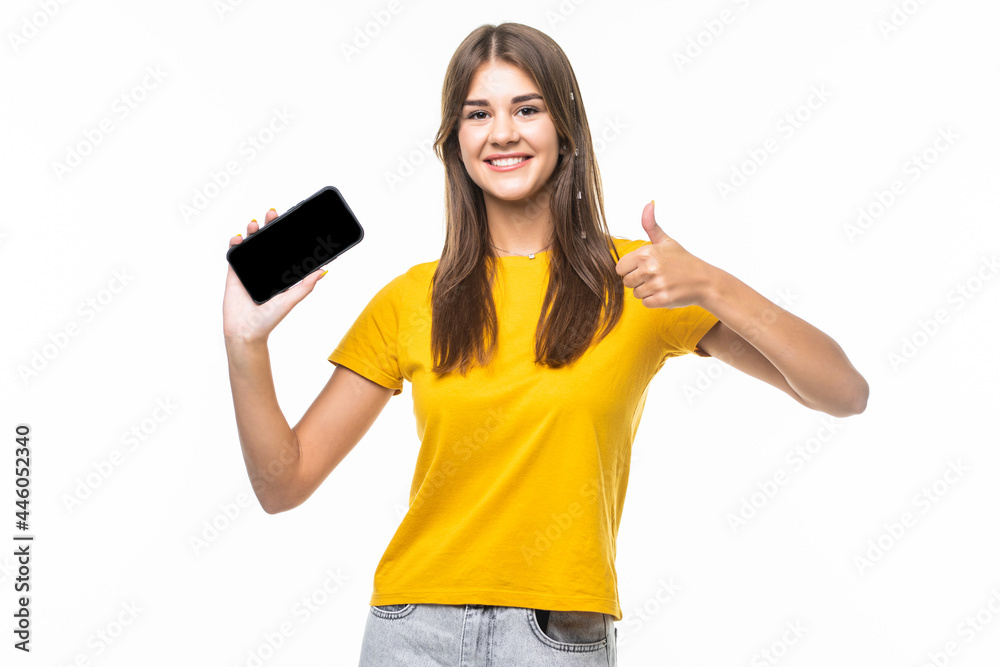 Beautiful woman showing a smart phone with thumb up isolated on white background Beautiful woman showing a smart phone with thumb up isolated on white background