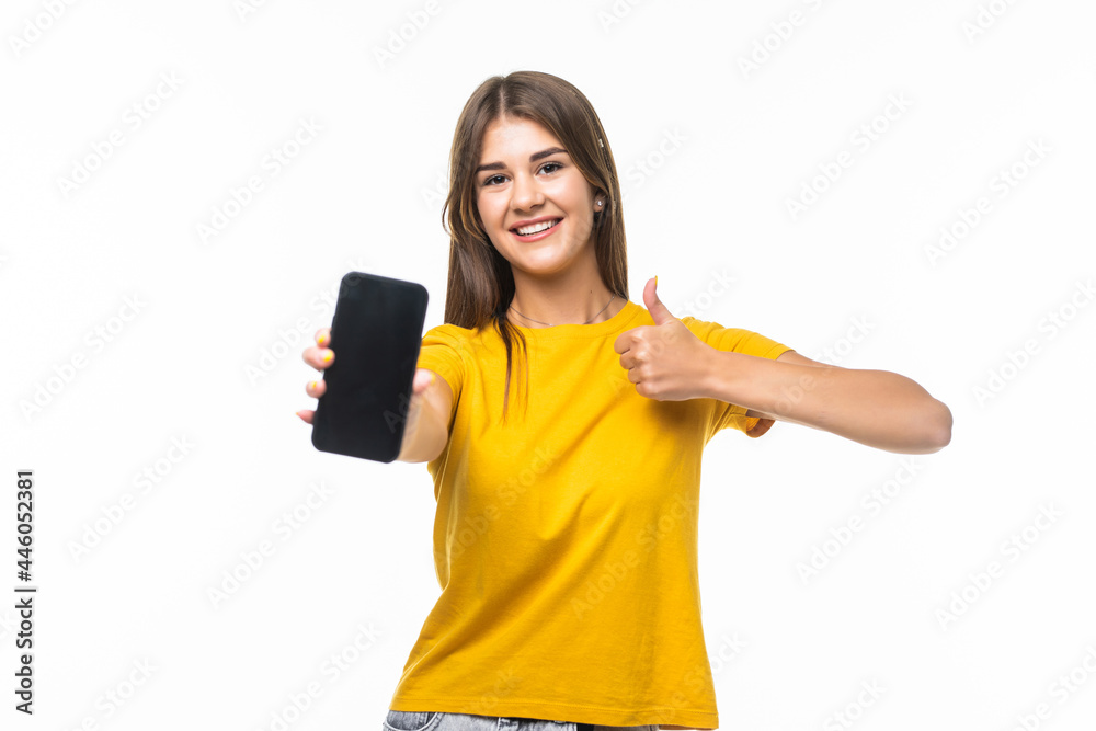 Beautiful woman showing a smart phone with thumb up isolated on white background
