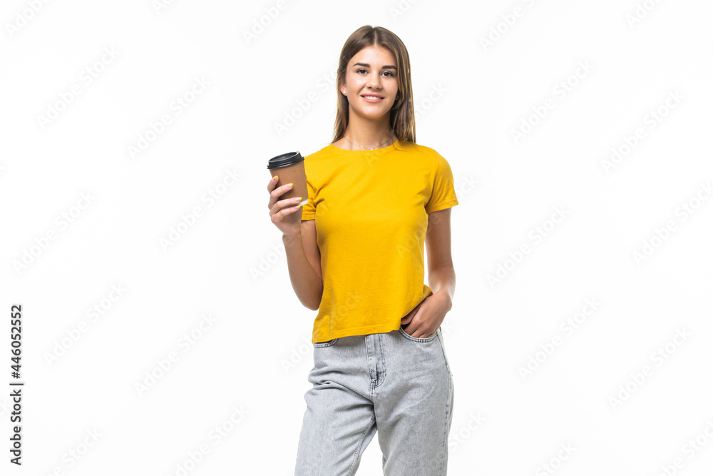 Young woman offers white cup of coffee isolated on gray background