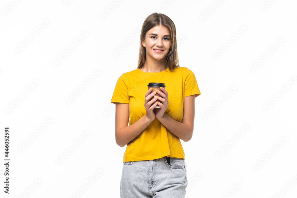 Young beautiful woman offers white cup of coffee on gray background