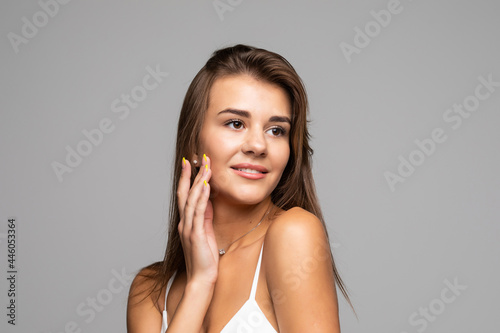 Portrait of young woman with perfect skin clean