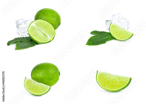 Fresh green juicy limes, lime slices, ice and mint leaves set isolated on white background.