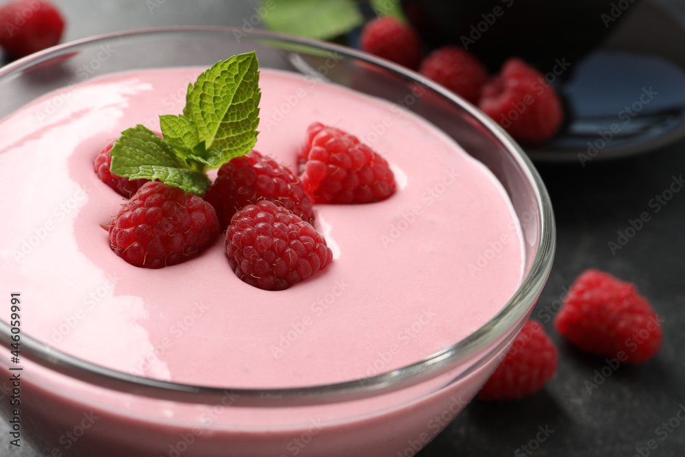 Delicious raspberry mousse with mint in glass dish, closeup Delicious raspberry mousse with mint in glass dish, closeup