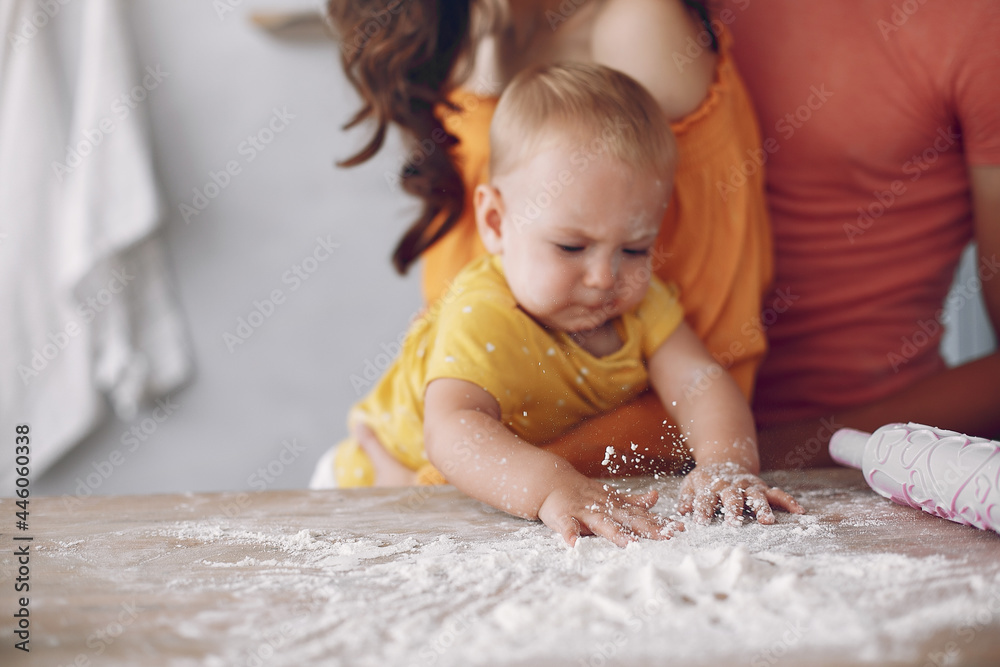 Beautiful family prepare food in a kitchen Beautiful family prepare food in a kitchen