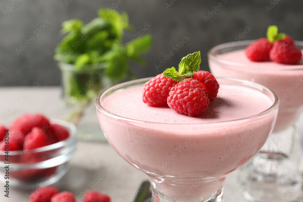 Glass of delicious raspberry mousse with mint, closeup Glass of delicious raspberry mousse with mint, closeup