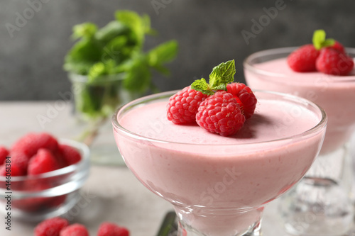 Glass of delicious raspberry mousse with mint, closeup