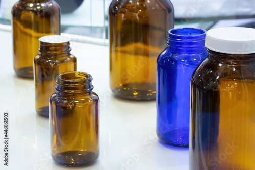 Empty medicine bottles on the Pharmtech Exhibition, low-grip