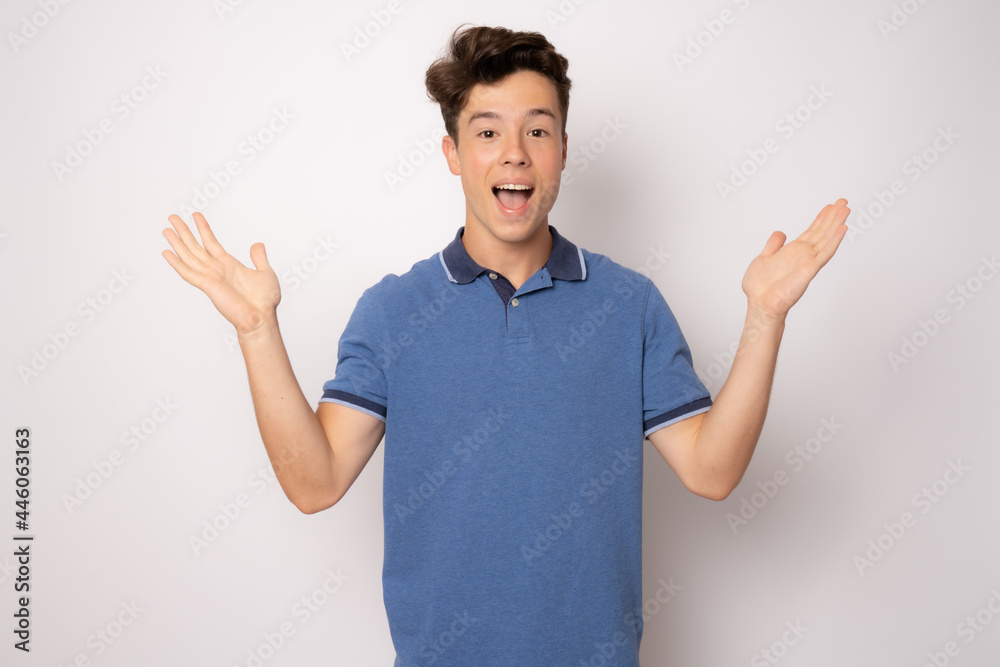 Amazed young man in casual clothing over white background. Amazed young man in casual clothing over white background.