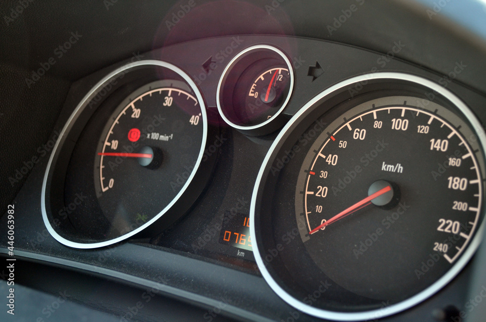 Fototapeta premium Close-up view of red speedometer hands in a car