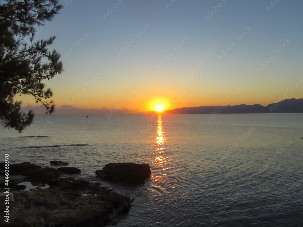 Sunrise over the sea near the island of Crete
