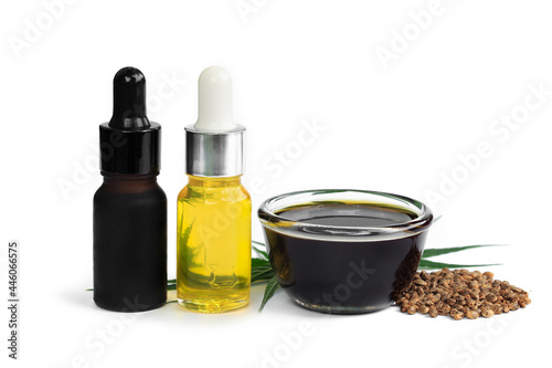 Hemp oil in a glass jar isolated on a white background, Pure cold pressed oils concept, CBD hemp oil.