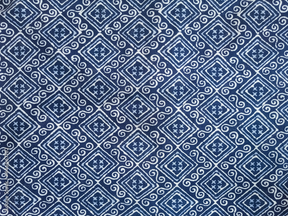 The blue fabric is dyed with a white grid pattern.