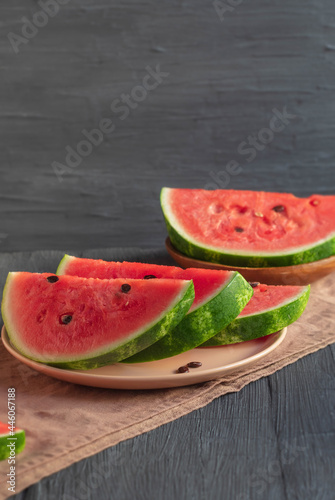 The vertical photo shows a fresh and juicy watermelon in a dessert plate