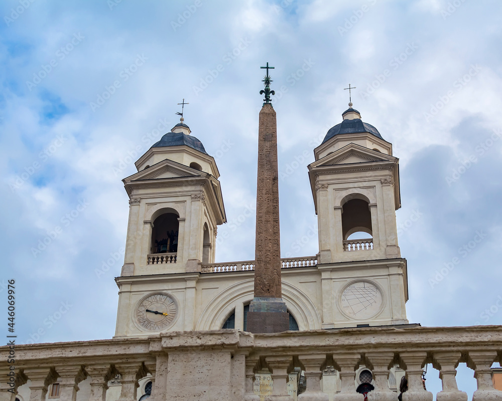 A view of The bell towers of Trinita dei Monti church and The Obelisk Sallustiano, located above the Spanish Steps in Rome, Italy