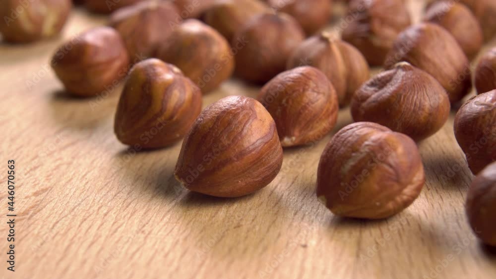 Appetizing hazelnuts on a wooden surface. Macro. Dolly Shot Appetizing hazelnuts on a wooden surface. Macro. Dolly Shot
