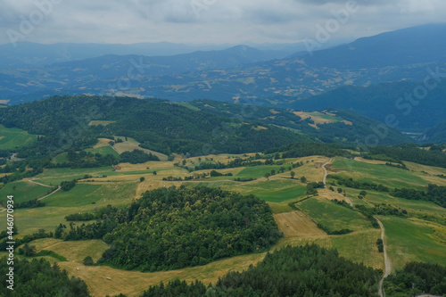 Aerial view of landscape with fields, mountains, woods, and blue sky. natural background. 