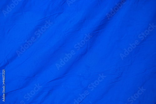 Blue crumpled old with tent fabric page paper texture rough background. crease grunge parchment pattern vintage design