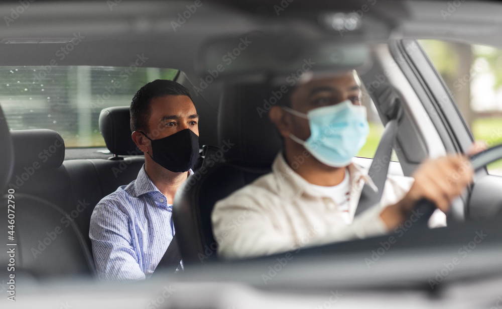 transportation, health and people concept - male passenger wearing face protective mask for protection from virus disease and indian taxi driver driving car