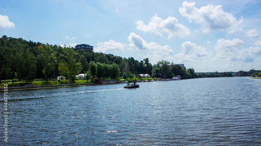 A large multi-storey building on the outskirts of the city. View from the Moscow River