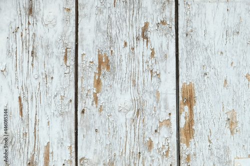 Old wooden texture. White peeled paint old door. Vintage background.