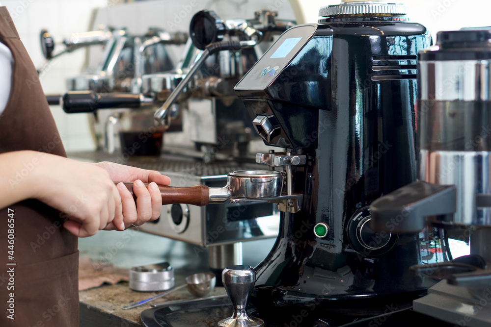 Barista making fresh espresso coffee. Espresso Machine Portafilters. Closeup