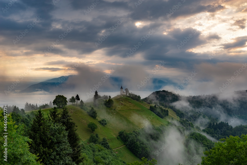 Panoramic image of Saint Primoz church in Jamnik, Slovenia on a summer day sunrise.