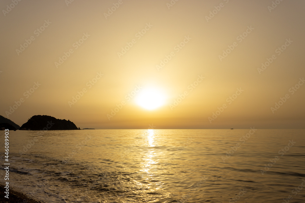 Beautiful view of seaside at dawn. Sunrise view with waves and sea. Landscape of rising sun over the sea in Cirali, Antalya, Turkey.