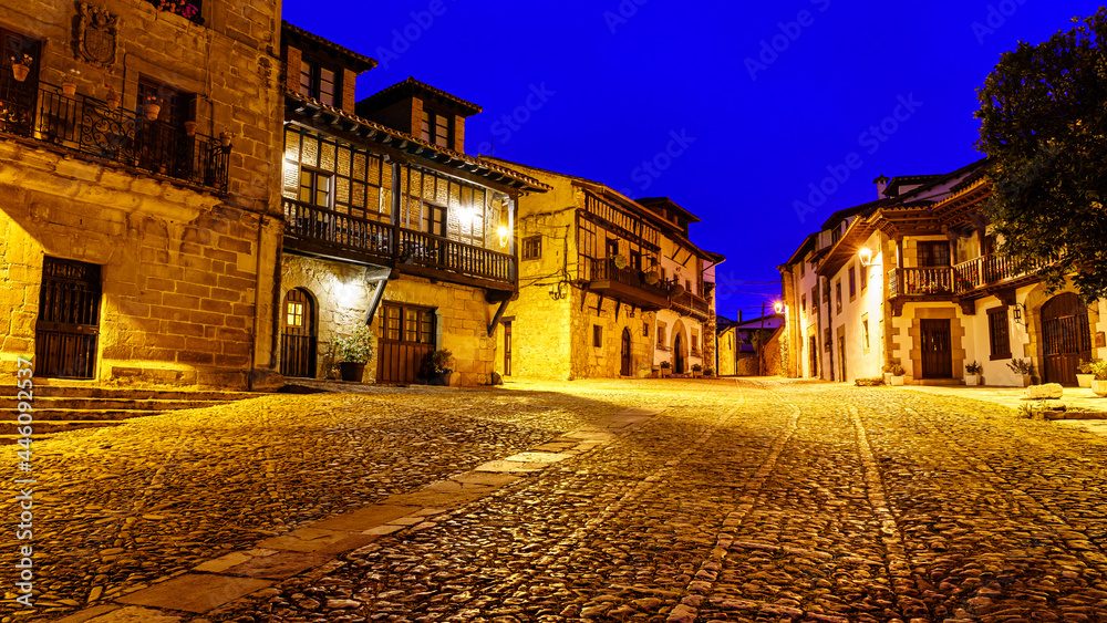 Old town street with cobblestone ground at dusk. Santillana del Mar, Santander.
