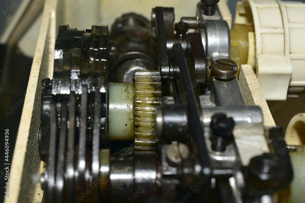 Close-up shot of the internal mechanism of the sewing machine. Close-up shot of the internal mechanism of the sewing machine.