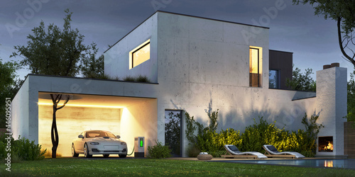 Modern concrete house with outdoor fireplace and electric vehicle charging station