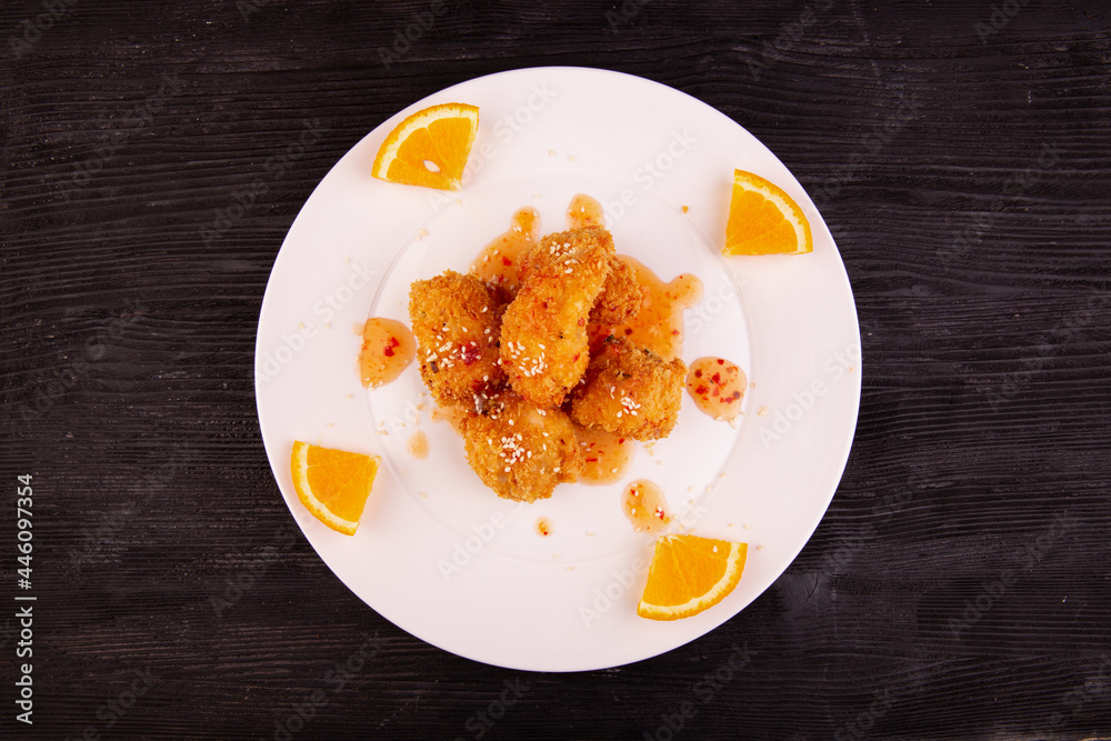 fried chicken, orange, sesame, sauce, served with steam rice fried chicken, orange, sesame, sauce, served with steam rice