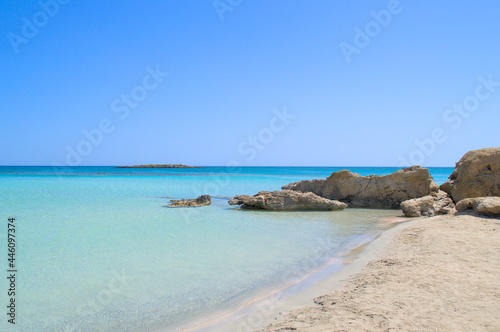 Rocky stones on a paradise sandy shore.