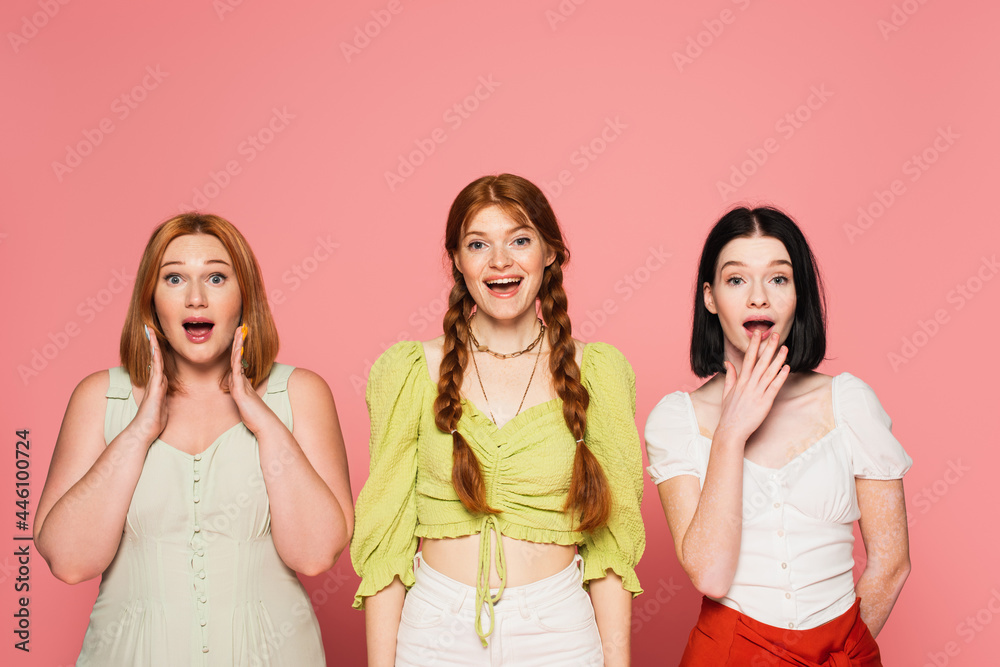 Excited body positive women looking at camera isolated on pink Excited body positive women looking at camera isolated on pink